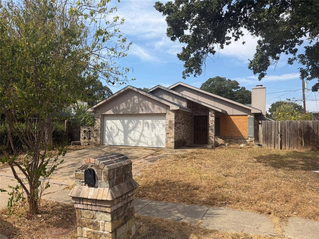 Stone and brick facade with a two-car garage