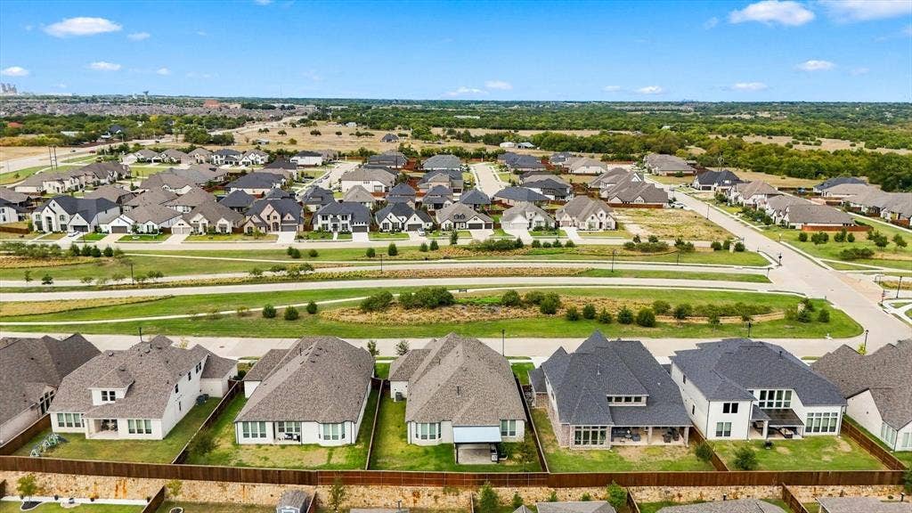 4230 Crown Run Road, Midlothian, TX 76065 Home sits at the high point in the neighborhood across from greenspace.