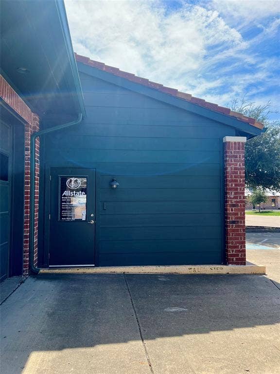 123 W Princeton Drive, #200, Princeton, TX 75407 Brick and siding exterior with concrete tile roof