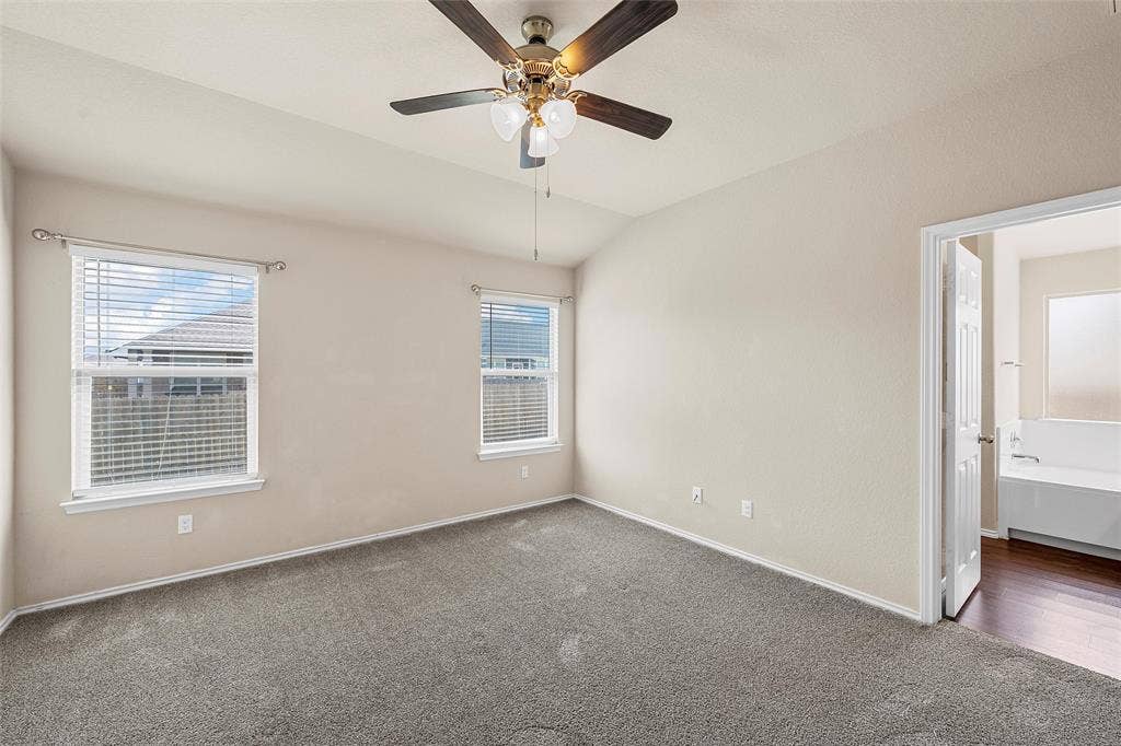 3217 Beutel Road, Lorena, TX 76655 Unfurnished room with carpet, ceiling fan, and lofted ceiling