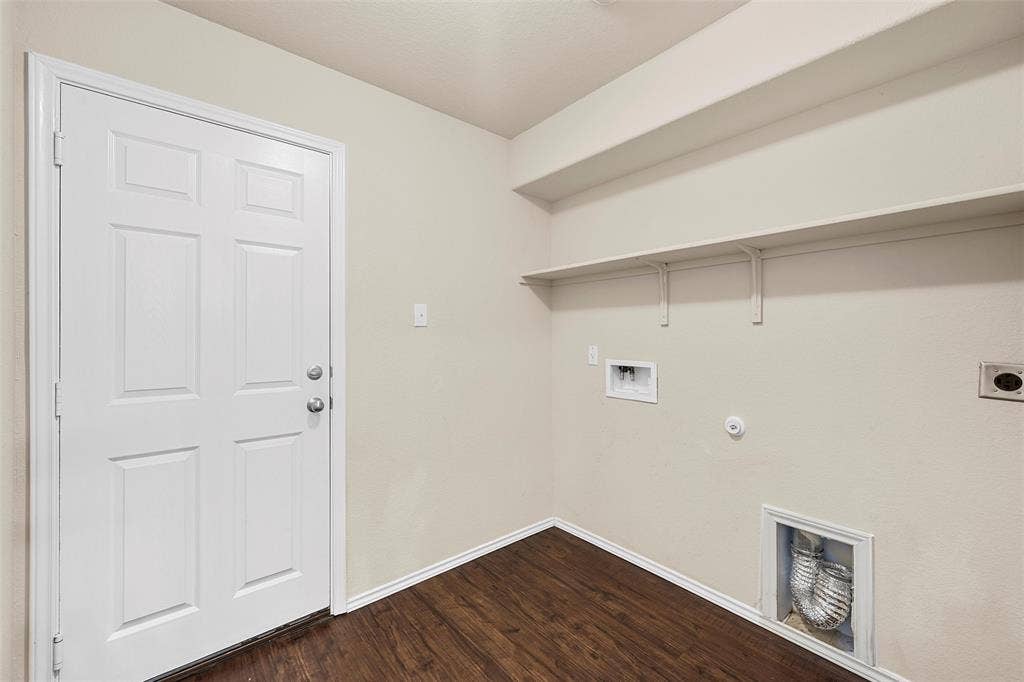 3217 Beutel Road, Lorena, TX 76655 Laundry area featuring hookup for a washing machine, hookup for an electric dryer, dark wood-style floors, and gas dryer hookup