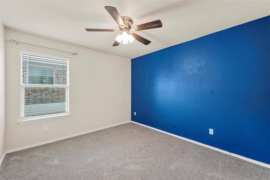 3217 Beutel Road, Lorena, TX 76655 Spare room with carpet flooring and ceiling fan