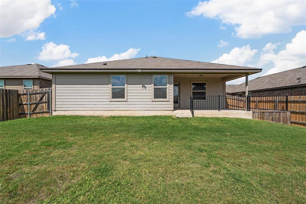 3217 Beutel Road, Lorena, TX 76655 Back of property featuring a patio area and a fenced backyard