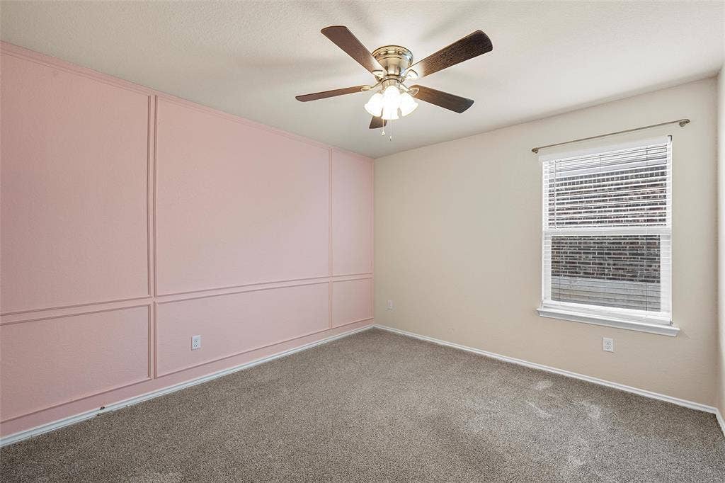 3217 Beutel Road, Lorena, TX 76655 Carpeted empty room with ceiling fan and baseboards