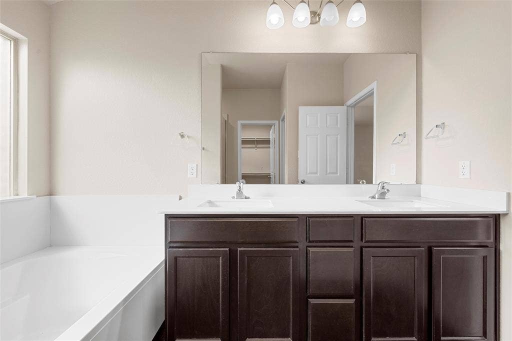 3217 Beutel Road, Lorena, TX 76655 Full bathroom featuring double vanity and a bath