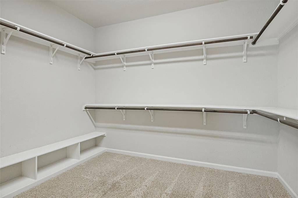 Large walk-in closet with built-ins