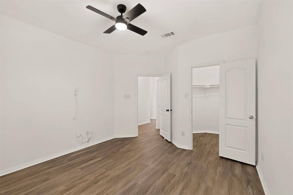 14908 Riverside Drive, Little Elm, TX 75068 Wood-finish flooring with crisp white walls and white trim