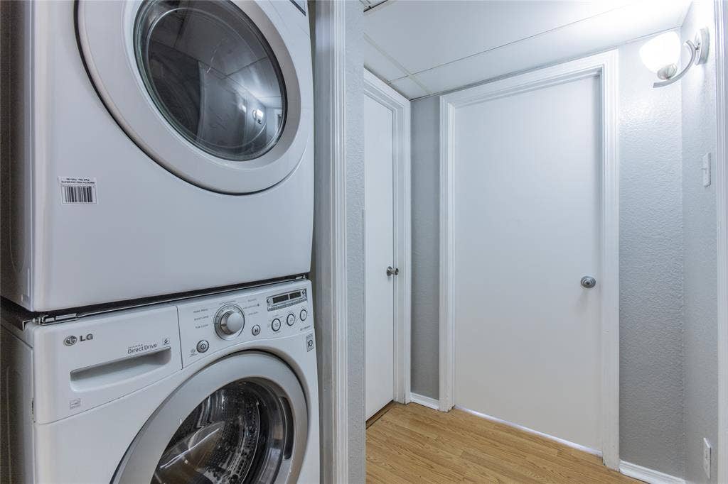 2308 Melissa Drive, #H5, Waco, TX 76708 Dedicated laundry area featuring a stacked washer and dryer unit