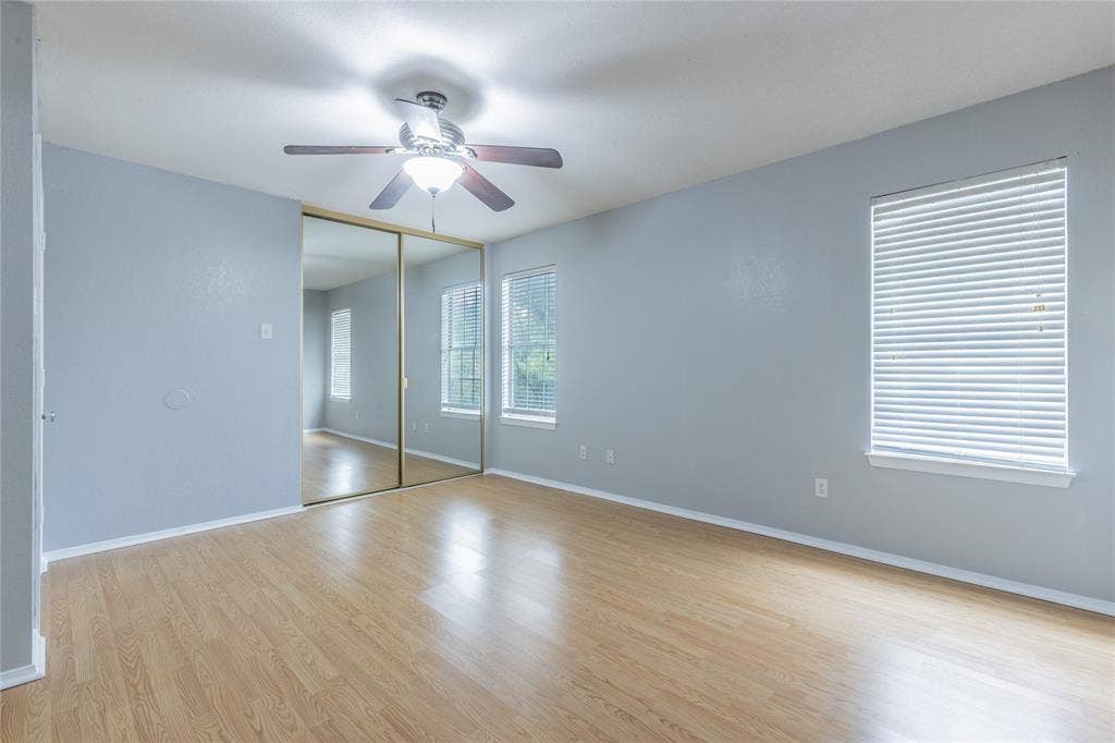 2308 Melissa Drive, #H5, Waco, TX 76708 Wood-finish flooring with a ceiling fan light fixture