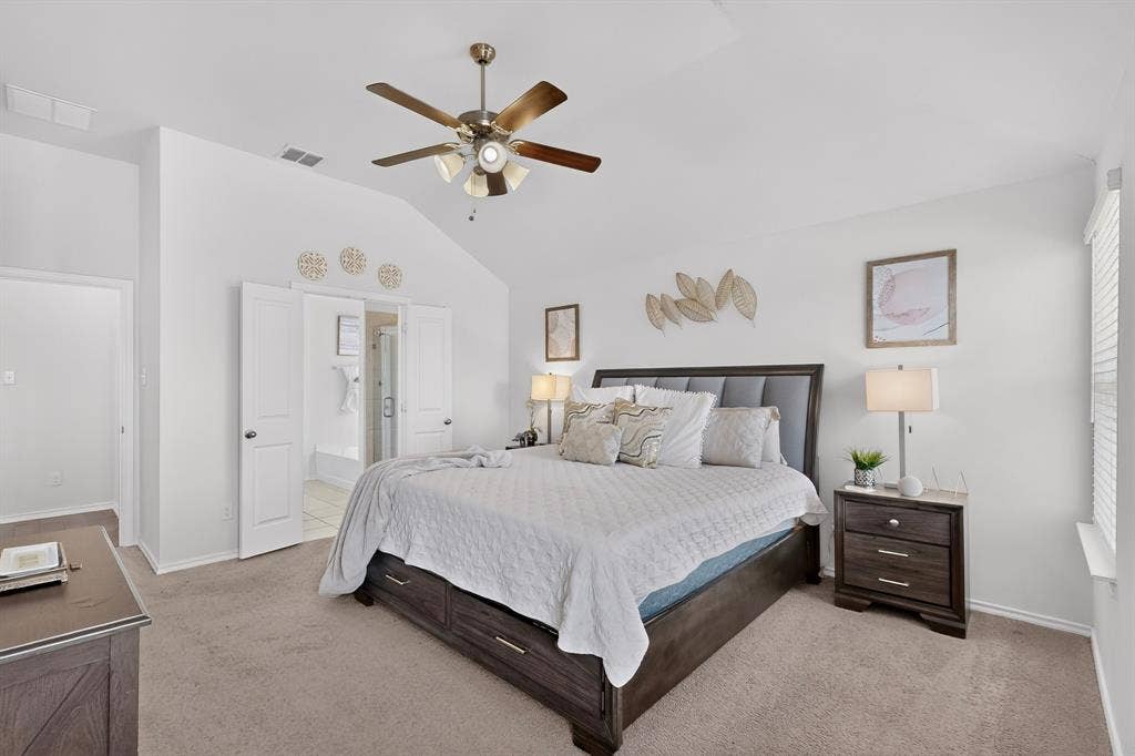 11700 Aldermoor Court, Fort Worth, TX 76036 Vaulted ceiling with a ceiling fan, light gray carpeting, and white interior doors