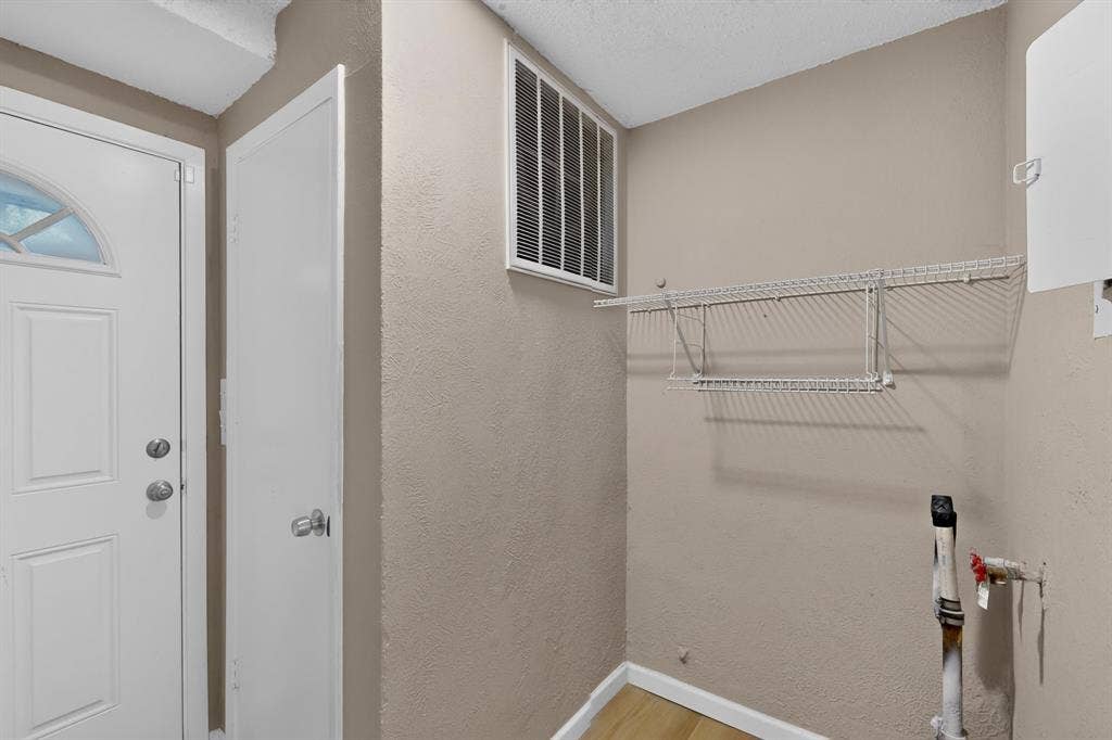 2314 Wales Place, Irving, TX 75062 White paneled door with arched glass insert