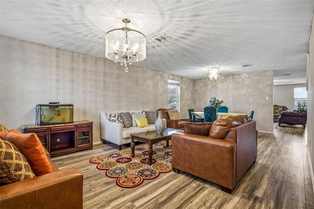 1856 Lariat Drive, Fort Worth, TX 76247 Living room and dining room as you enter the home.
