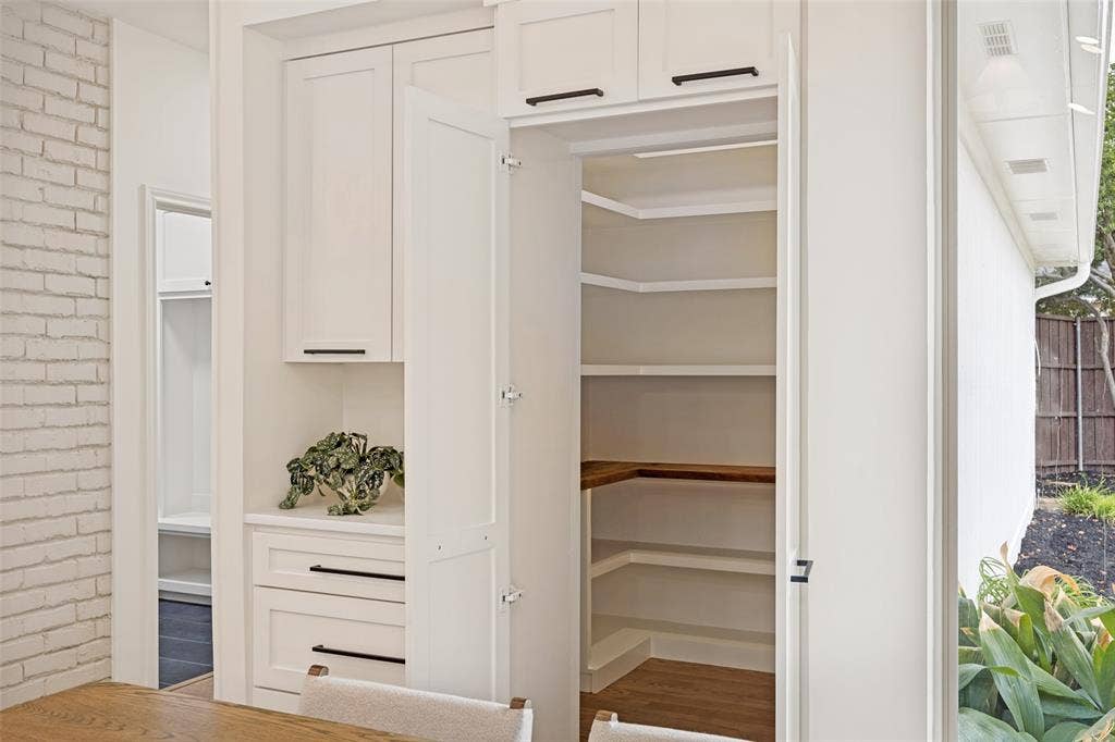 6707 Dupper Drive, Dallas, TX 75252 Breakfast area, notice opened hidden pantry door