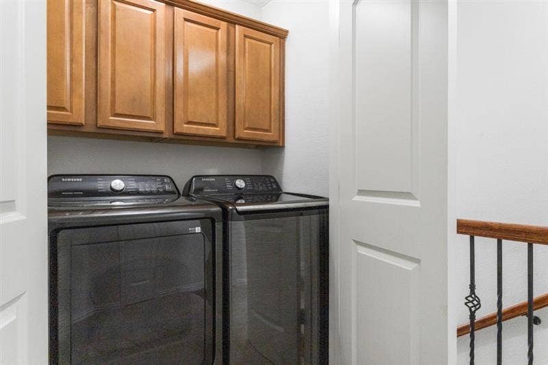 7944 Eddie Drive, Plano, TX 75025 Built-in wood-finish cabinetry, solid core doors, and a wrought iron banister with wood handrail