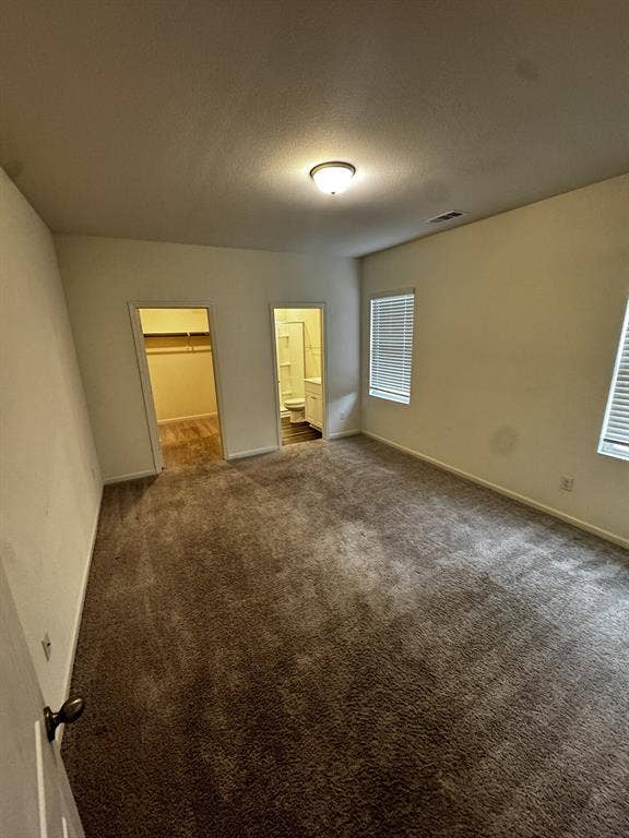 1813 Chapel Hill Road, Princeton, TX 75407 Carpeted flooring, two windows with blinds, flush mount ceiling light fixture, and two doorways