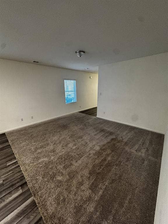 1813 Chapel Hill Road, Princeton, TX 75407 Neutral wall tones, recessed lighting, flush-mount ceiling fixture, window with blinds, and a combination of wood-finish flooring and carpeting