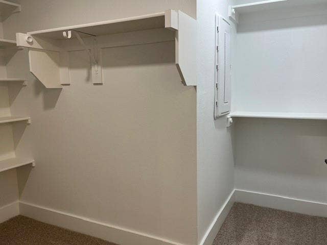 9473 Timberleaf Drive, Dallas, TX 75243 Built-in shelving units with white finishes and a textured wall surface