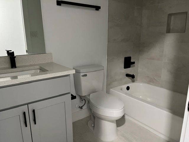 9473 Timberleaf Drive, Dallas, TX 75243 Vanity with a light-toned countertop and integrated sink