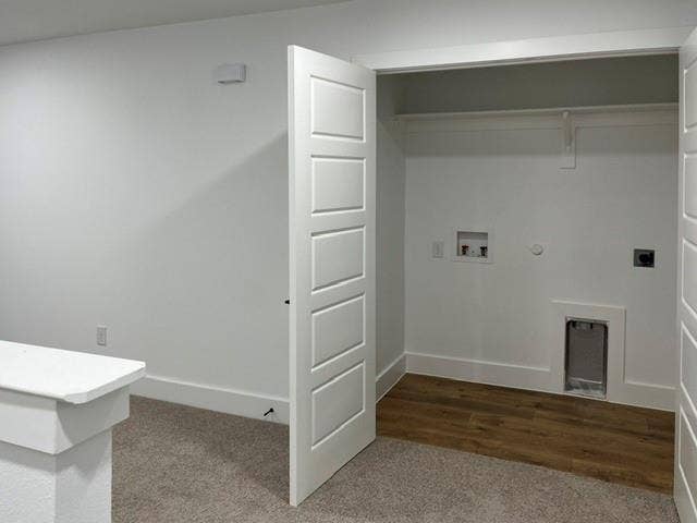 9473 Timberleaf Drive, Dallas, TX 75243 Dedicated laundry area with wood-finish flooring, white walls, and a built-in hanging rod