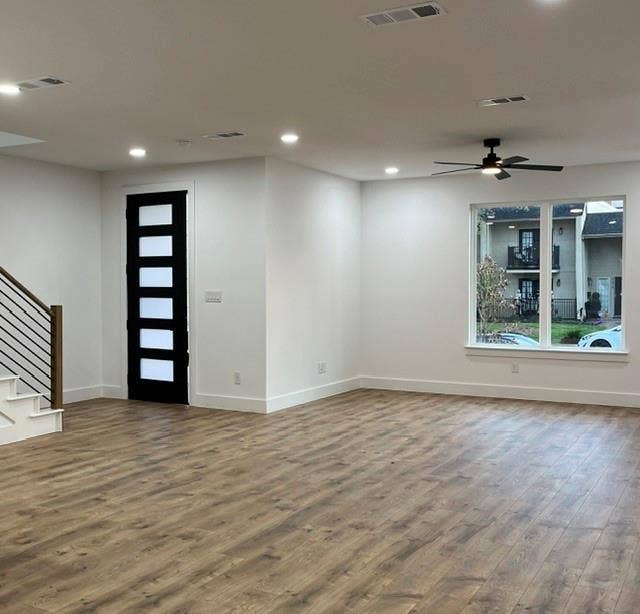 9473 Timberleaf Drive, Dallas, TX 75243 Spacious room with wood-finish flooring, recessed lighting, and a contemporary ceiling fan