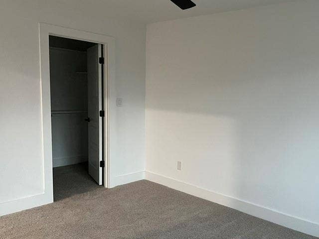 9473 Timberleaf Drive, Dallas, TX 75243 Neutral color palette, plush carpet flooring, white trim, solid core door, and a built-in closet with shelving and hanging rod