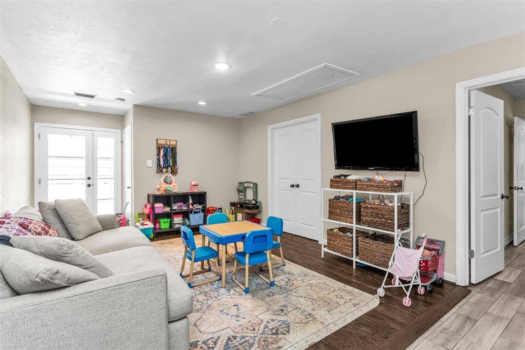 Third living area with access to pool and backyard.  Currently used as a playroom.