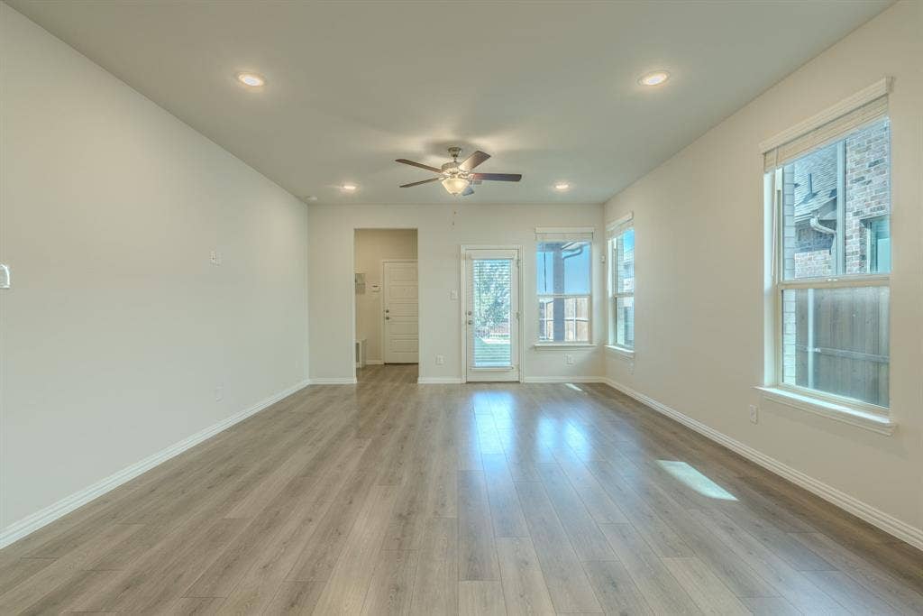 Entrance to covered patio and back yard with easy access to garage and mudroom.