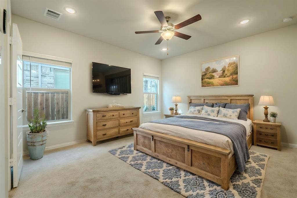 Virtually staged primary bedroom on main floor