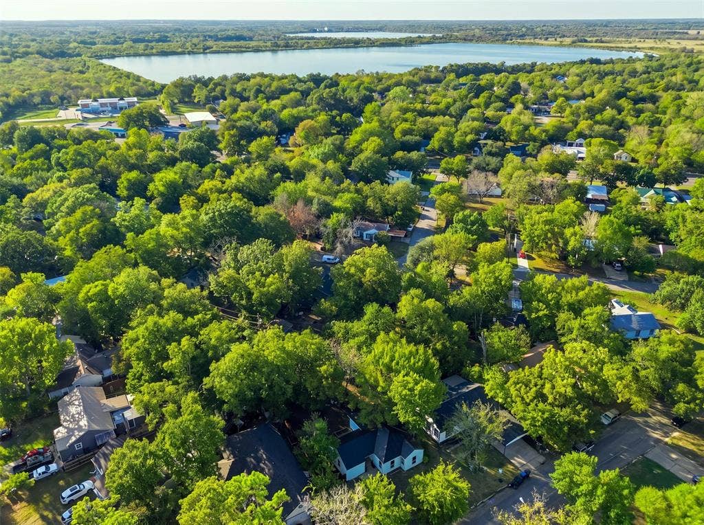 1105 Bell Drive, Greenville, TX 75401 Lakeside community with extensive tree canopy and residential streets