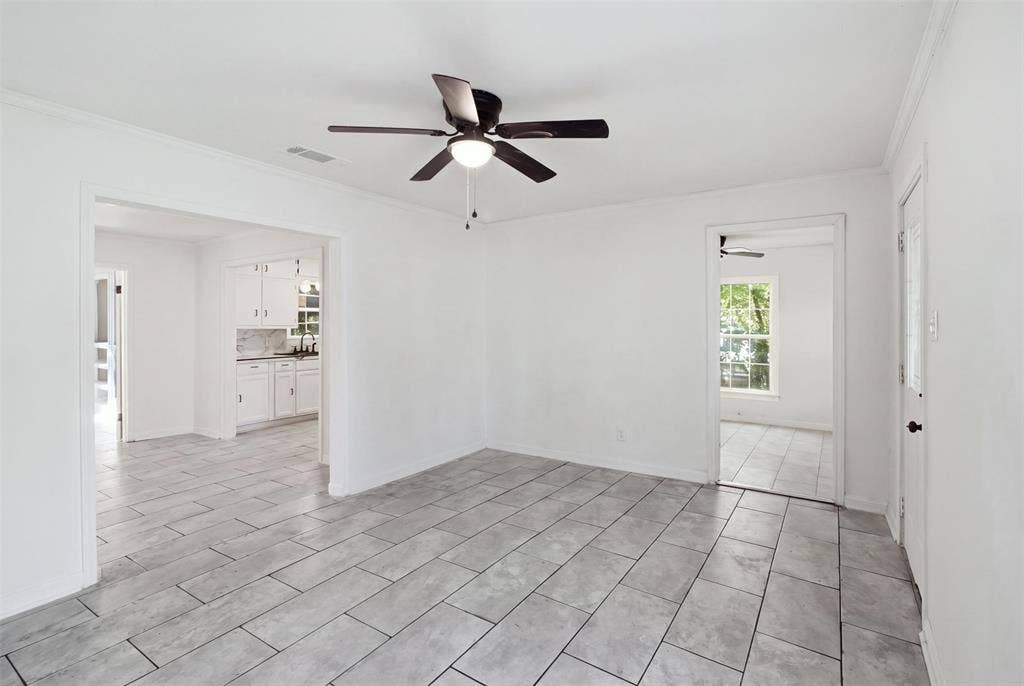 1105 Bell Drive, Greenville, TX 75401 Recessed lighting, ceiling fan, tile flooring, white cabinetry, and a window for natural illumination