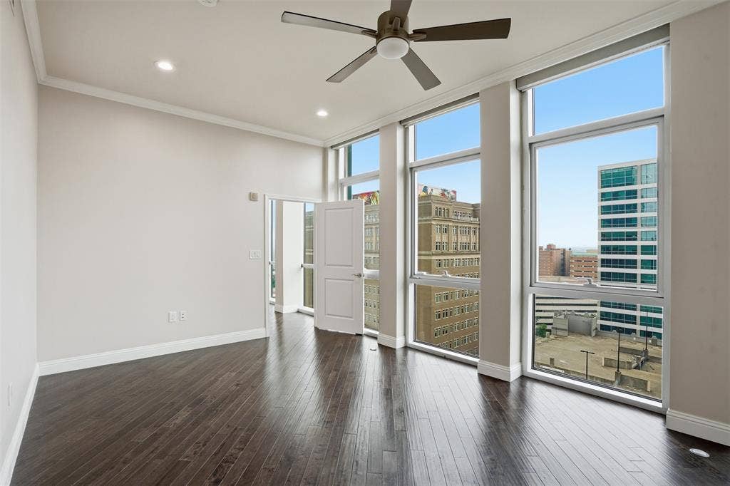 500 Throckmorton Street, #1605, Fort Worth, TX 76102 High ceilings, dark wood-finish flooring, recessed lighting, ceiling fan, and extensive windows
