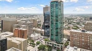 500 Throckmorton Street, #1605, Fort Worth, TX 76102 Expansive city landscape featuring diverse architectural structures and a prominent high-rise building with a glass facade
