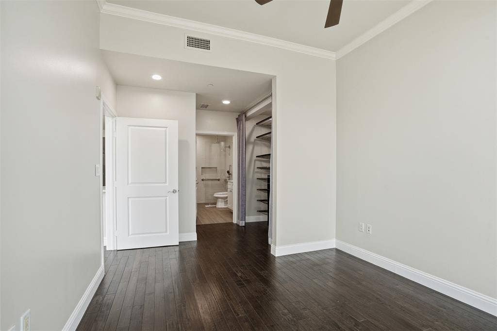 500 Throckmorton Street, #1605, Fort Worth, TX 76102 Dark wood-finish flooring with white baseboards