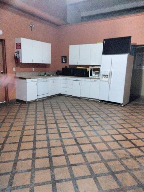 10424 County Road 1099, Princeton, TX 75407 White cabinetry with ample storage, integrated sink, and durable countertops