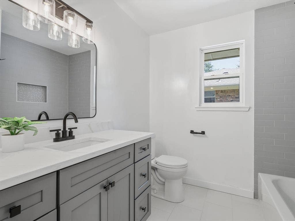 2500 Teakwood Lane, Plano, TX 75075 Vanity with quartz countertop, undermount sink, and matte black faucet