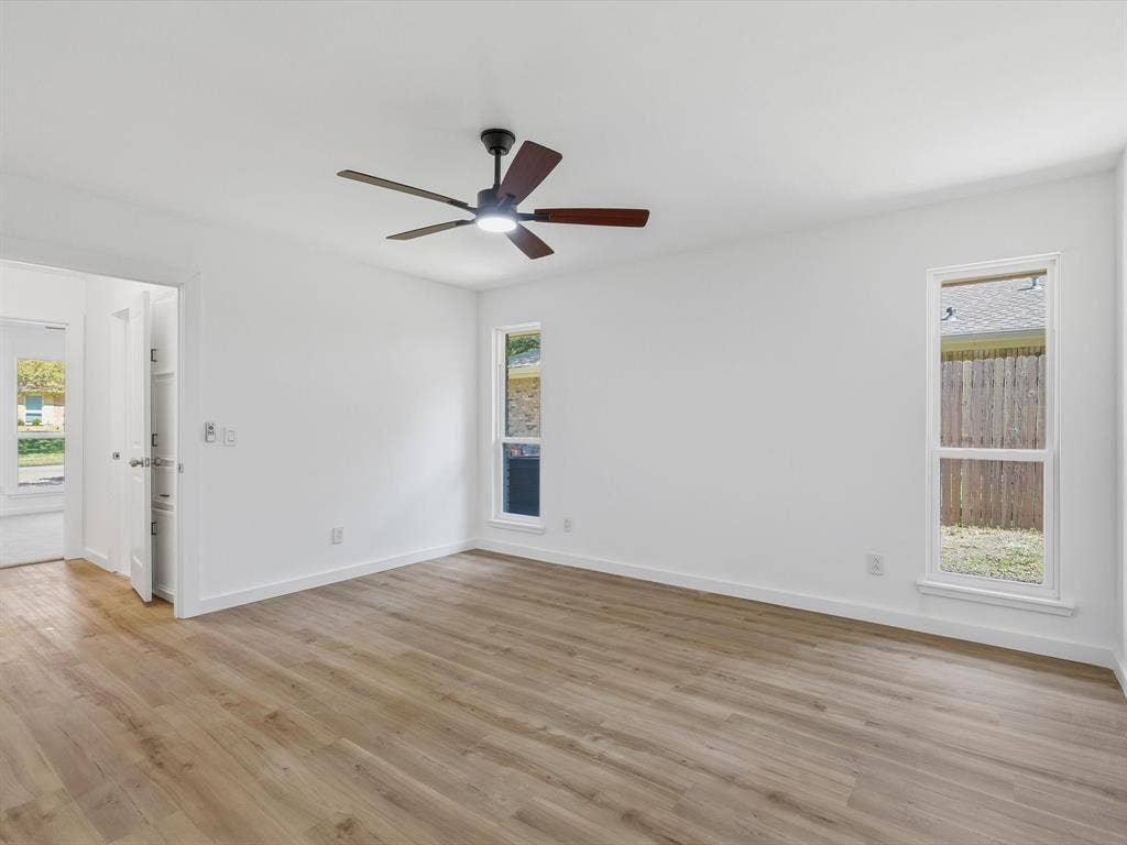 2500 Teakwood Lane, Plano, TX 75075 Hardwood-finish flooring, white walls, and a ceiling fan with integrated lighting