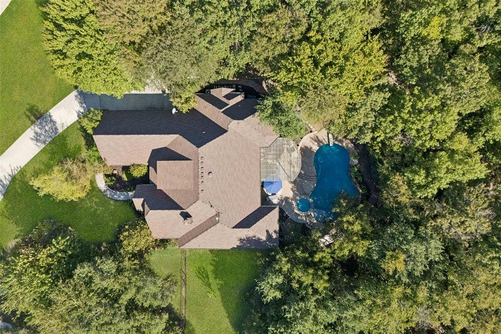 Tucked nicely within mature trees for nature views and privacy