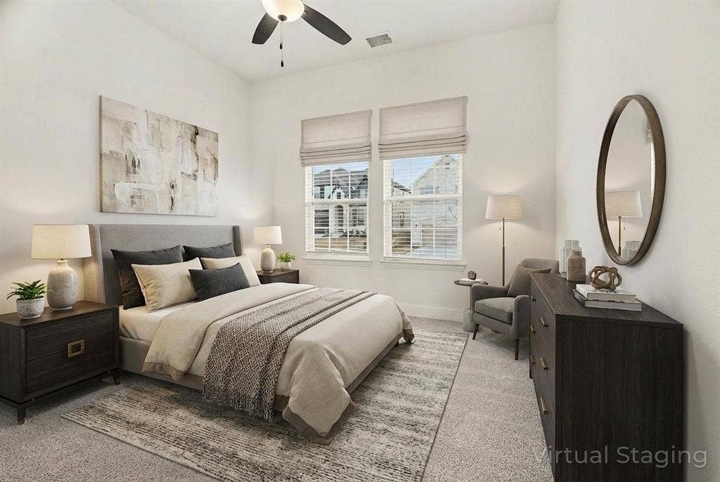 High ceilings featuring a central ceiling fan with integrated lighting and double windows with neutral Roman shades