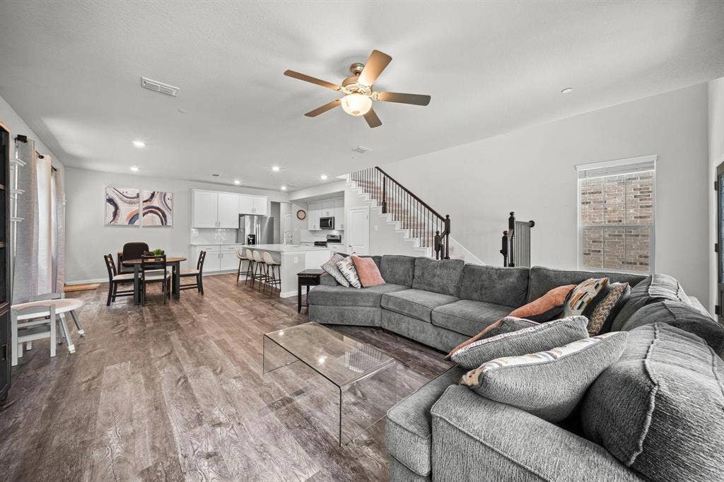 4129 Bullwhip Creek Lane, Sachse, TX 75048 Wood-finish flooring, recessed lighting, and a ceiling fan