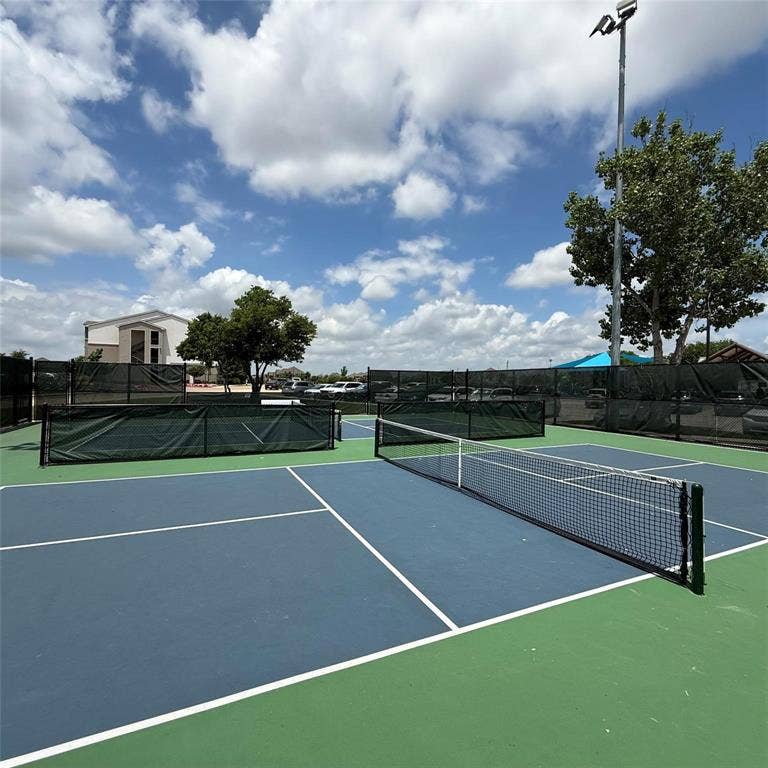 4129 Bullwhip Creek Lane, Sachse, TX 75048 Outdoor hard-surface court featuring a net and boundary lines