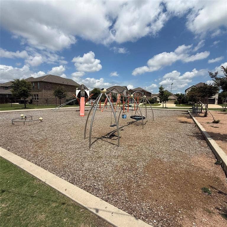 4129 Bullwhip Creek Lane, Sachse, TX 75048 Community playground featuring multiple play structures, swings, and a slide