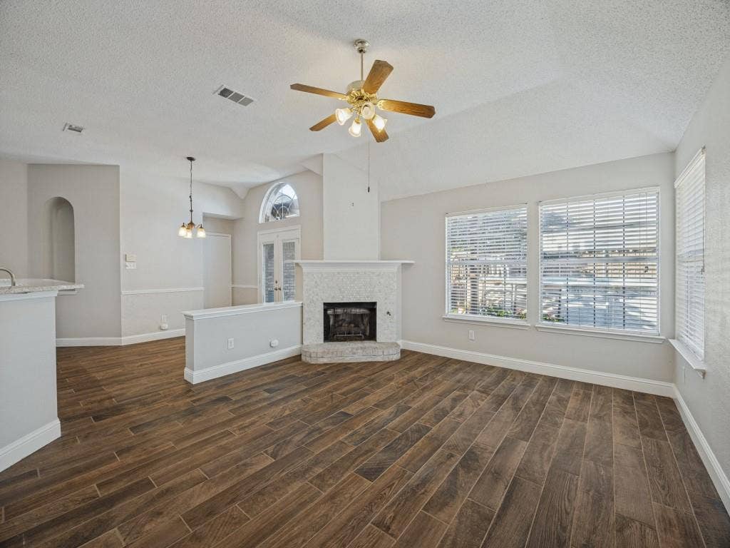 741 Lauren Way, Allen, TX 75002 Living room with fireplace and abundant natural light