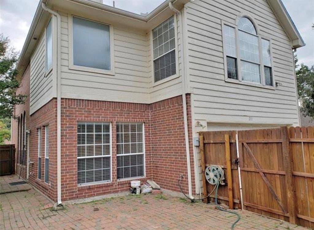 211 Moss Hill Road, Irving, TX 75063 Brick and siding exterior with multiple windows