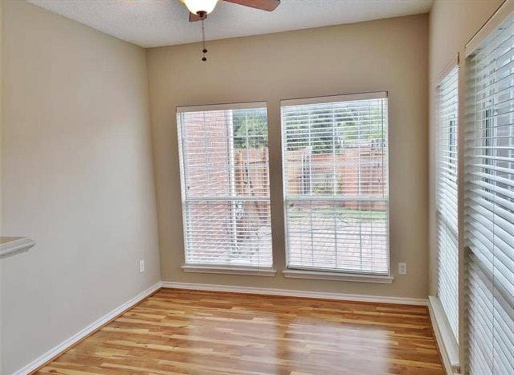 211 Moss Hill Road, Irving, TX 75063 Wood-finish flooring with white trim