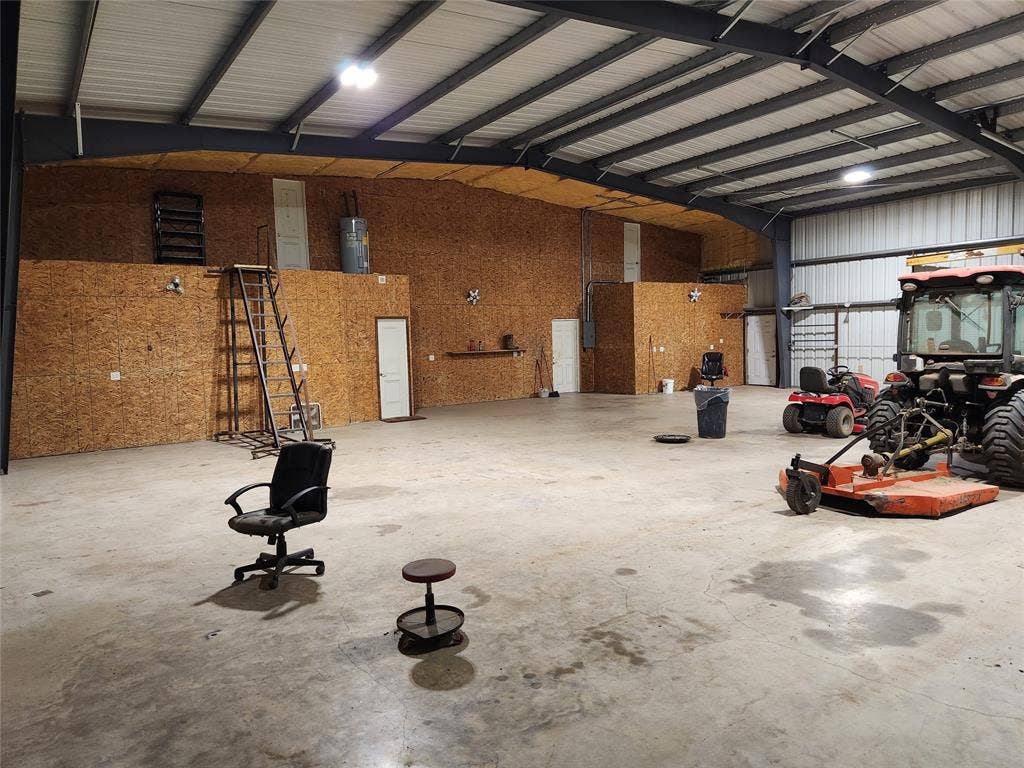 Large shop space, includes access to the attic.