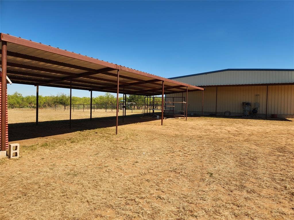 Shade structure, could be converted to animal stalls.