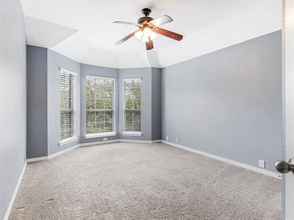 7419 Ravenhill Drive, Frisco, TX 75035 Recessed ceiling with a central fan fixture, bay windows with horizontal blinds, and carpeting