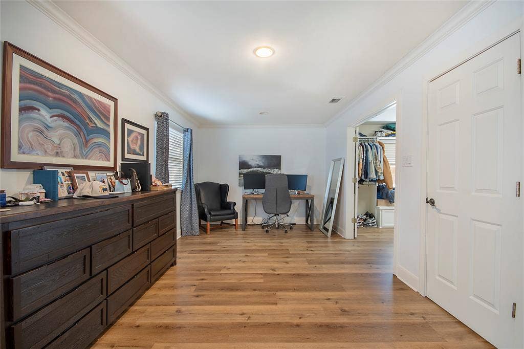 4074 Cedar Bayou Drive, Dallas, TX 75244 Wood-finish flooring throughout, crown molding detail, recessed lighting, and a six-panel door