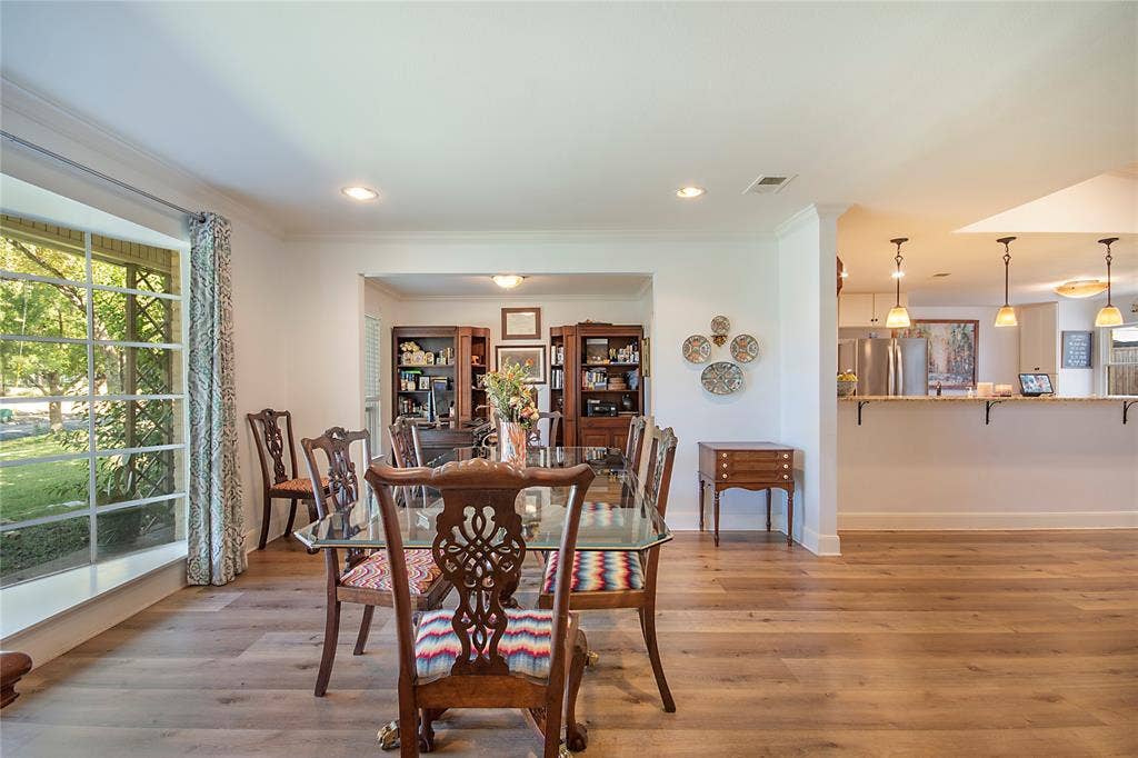 4074 Cedar Bayou Drive, Dallas, TX 75244 Wide plank wood-finish flooring, recessed lighting, and a bay window