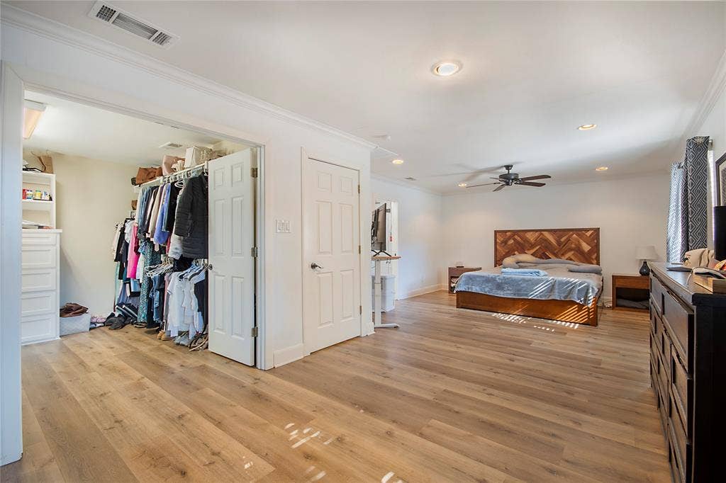 4074 Cedar Bayou Drive, Dallas, TX 75244 Spacious interior with wood-finish flooring, recessed lighting, ceiling fan, and crown molding